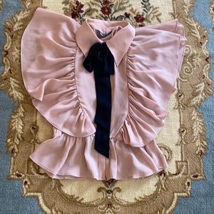 Blush pink blouse with neck tie.